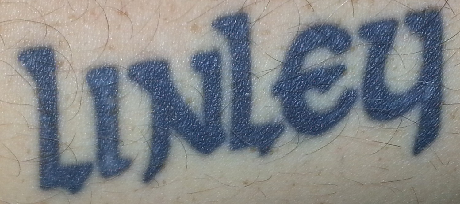 Please help me with the tattoo of my daughter's name Font sample to identify the typeface on WhatFontIs